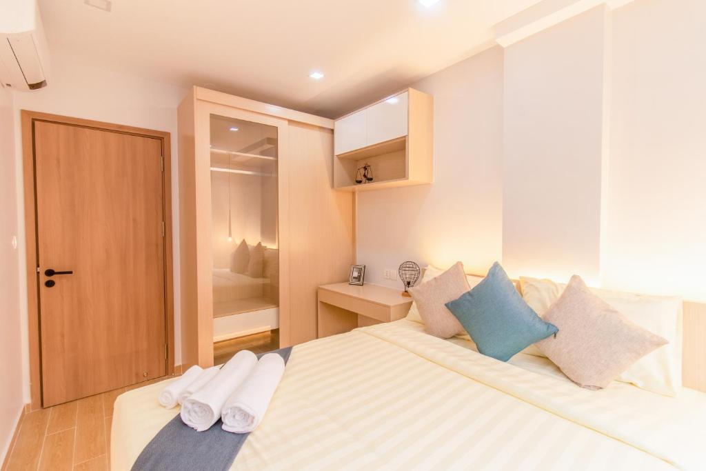 Postel nebo postele na pokoji v ubytování Sky Park Condotel & Residence