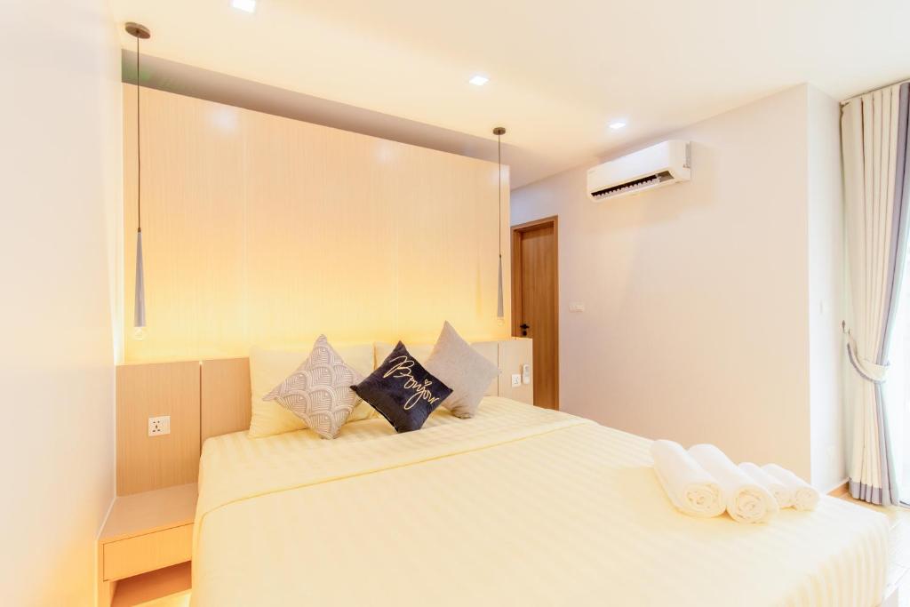 Postel nebo postele na pokoji v ubytování Sky Park Condotel & Residence