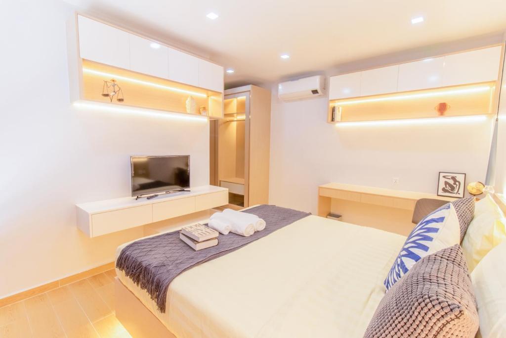 Postel nebo postele na pokoji v ubytování Sky Park Condotel & Residence