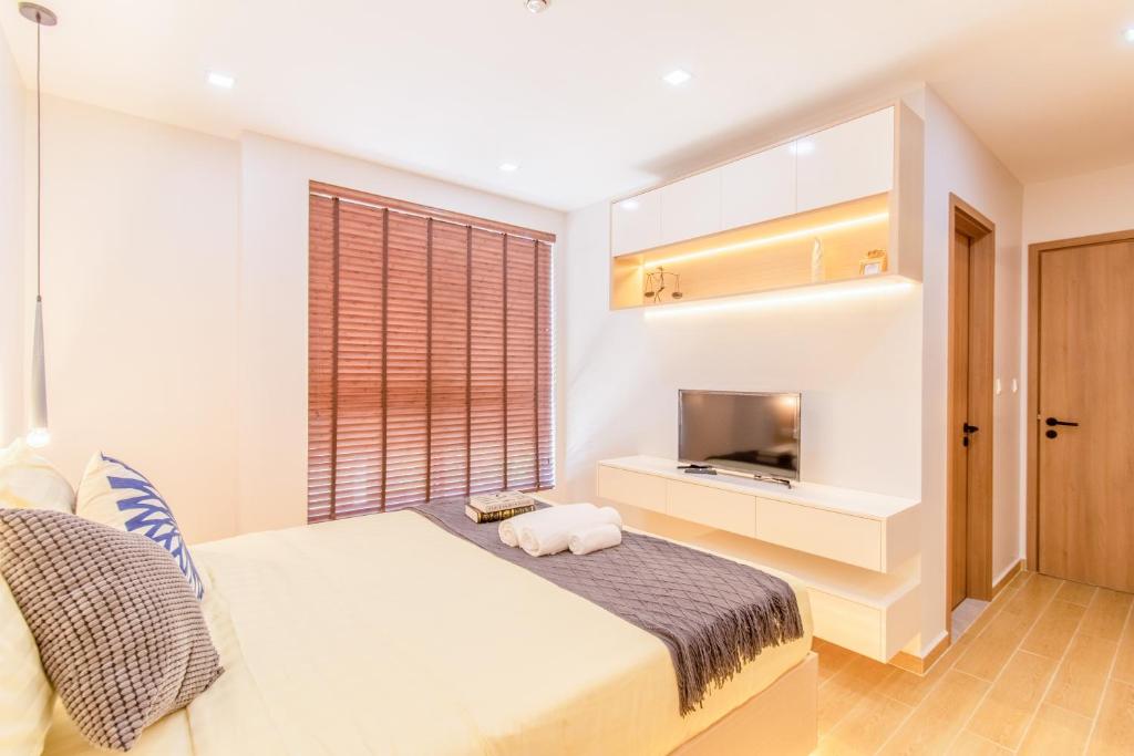 Postel nebo postele na pokoji v ubytování Sky Park Condotel & Residence