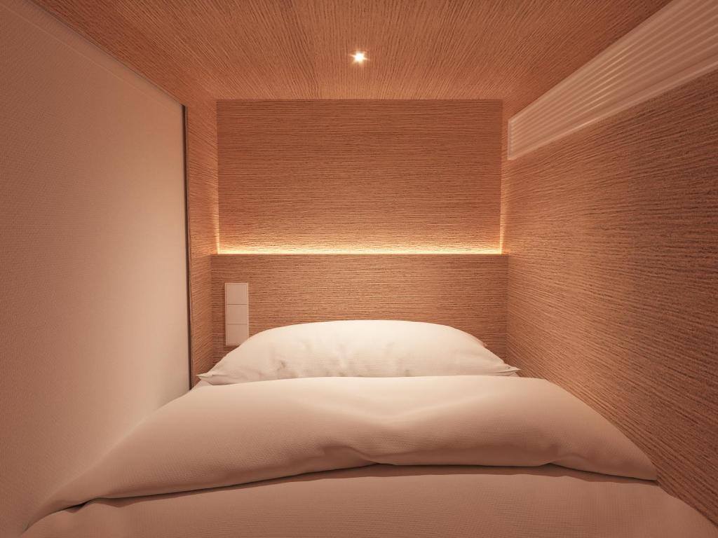 Postel nebo postele na pokoji v ubytování Literal Hotel