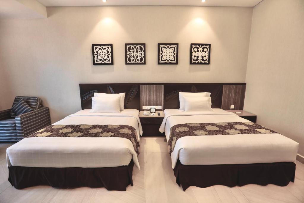 Postel nebo postele na pokoji v ubytování Bangi Resort Hotel
