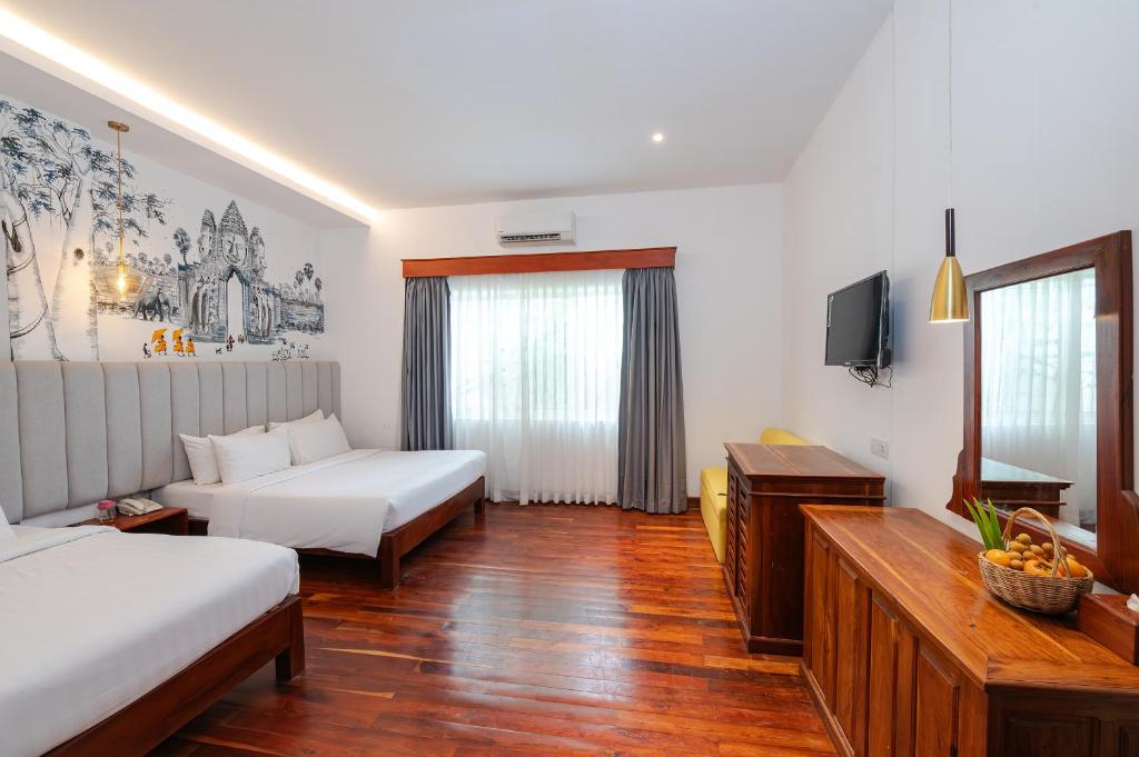 Postel nebo postele na pokoji v ubytování Victoria Central Residence