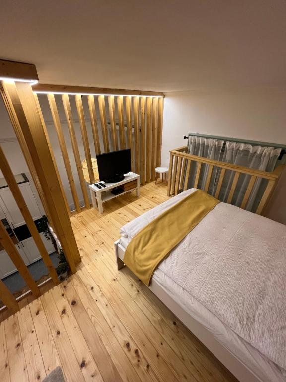 Postel nebo postele na pokoji v ubytování Bocskai Apartman