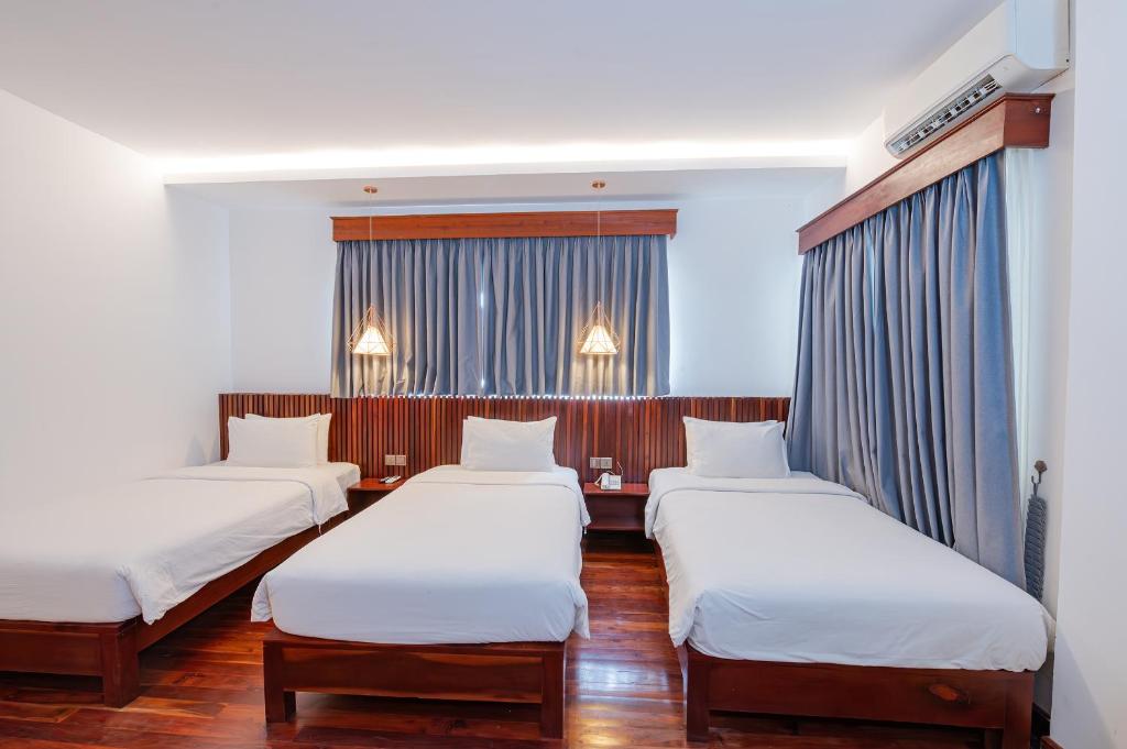 Postel nebo postele na pokoji v ubytování Victoria Central Residence