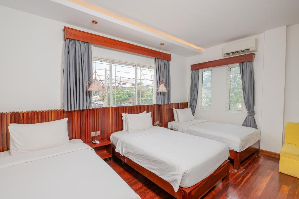 Postel nebo postele na pokoji v ubytování Victoria Central Residence