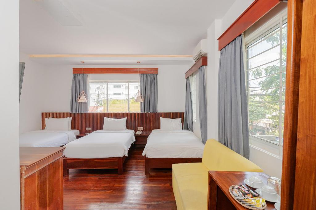 Postel nebo postele na pokoji v ubytování Victoria Central Residence