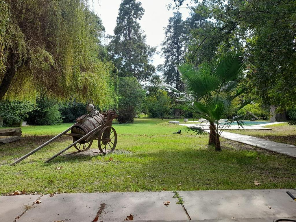 a statue of a cart in a park at CASA DE CAMPO LA MAGNOLIA in Junín