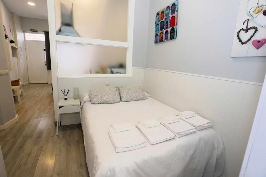 A bed or beds in a room at La casita de Valvanera