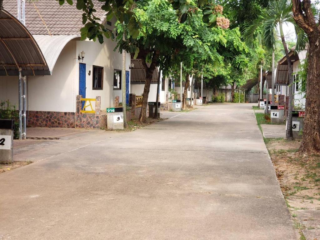 an empty street in front of a building at Phontong Garden Resort in Kalasin