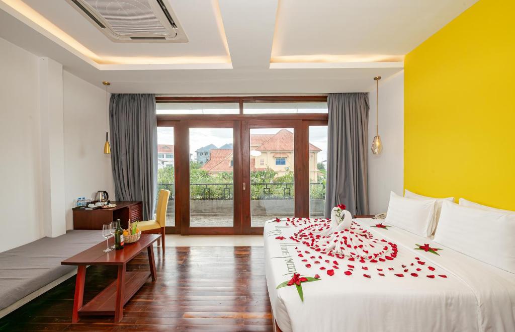 Postel nebo postele na pokoji v ubytování Victoria Central Residence
