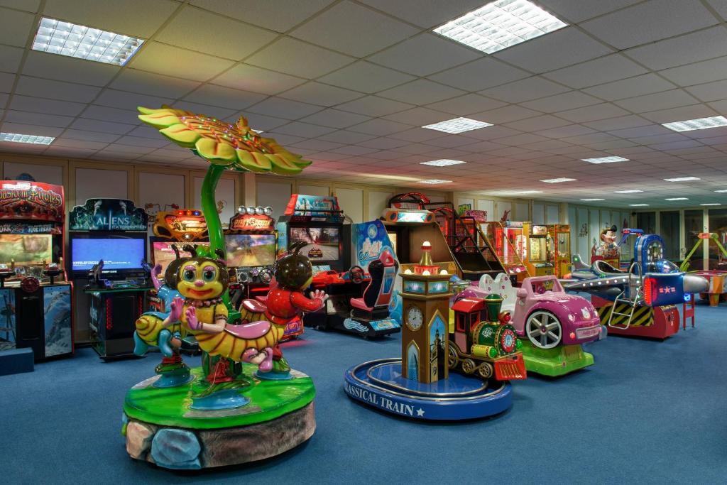 a room filled with lots of different types of video games at Megasaray Club Belek in Belek