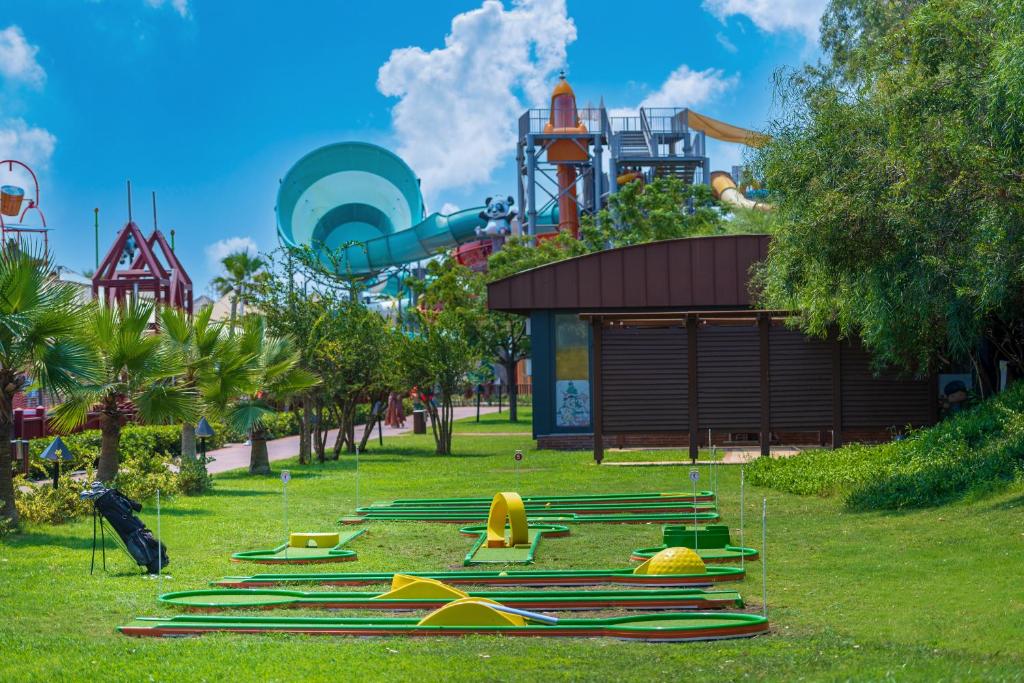 a park with a water park with a roller coaster at Megasaray Club Belek in Belek