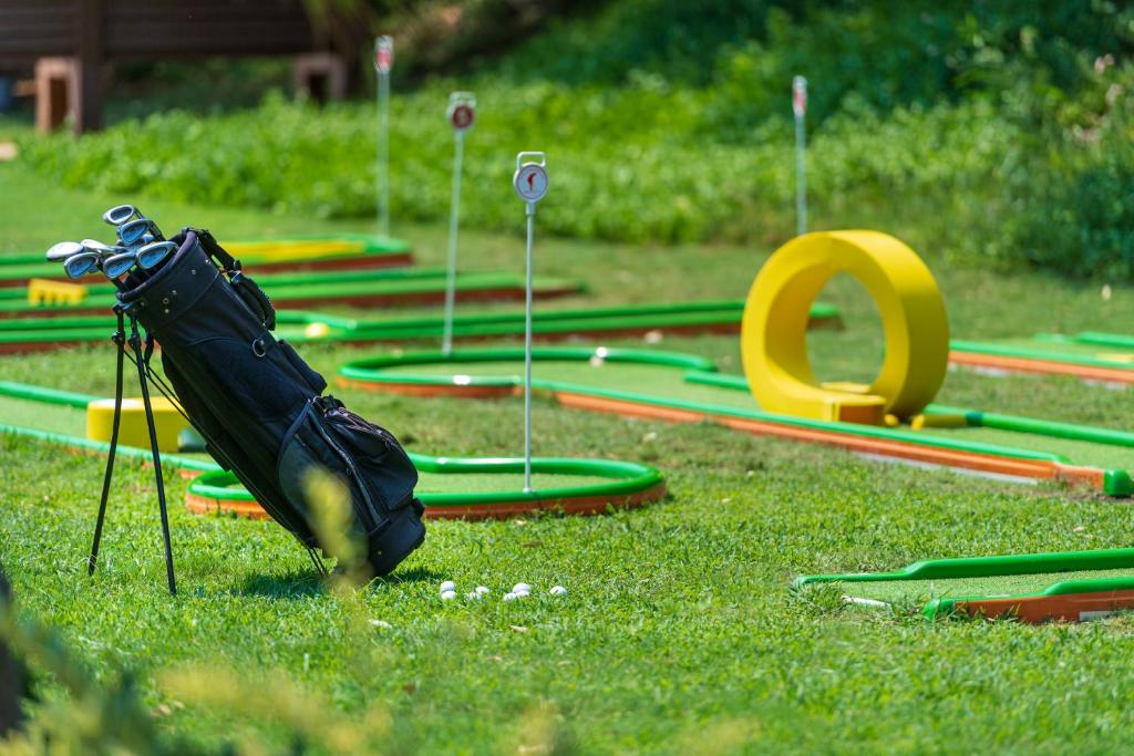 a group of hoses on the grass in a park at Megasaray Club Belek in Belek