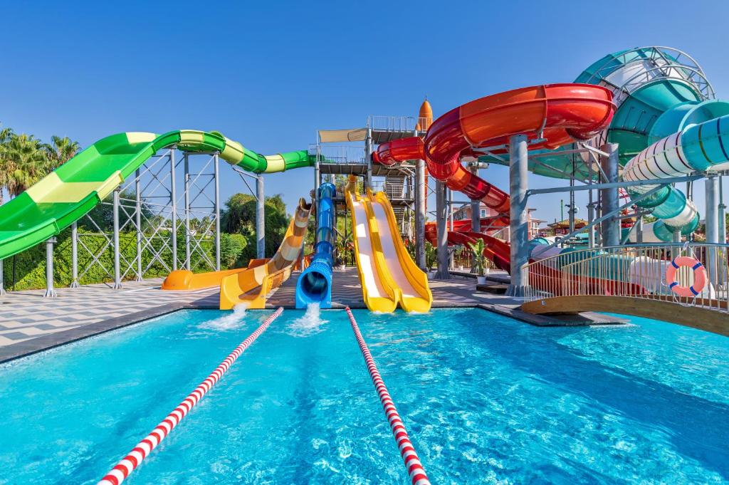 a swimming pool with slides and water slidesktop at Megasaray Club Belek in Belek