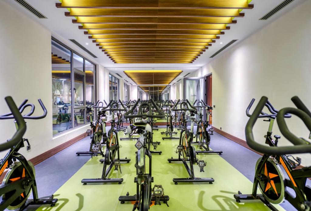a row of exercise bikes in a gym at Megasaray Club Belek in Belek