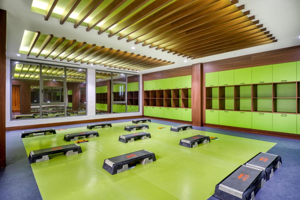 a large room with green lockers and tables in it at Megasaray Club Belek in Belek