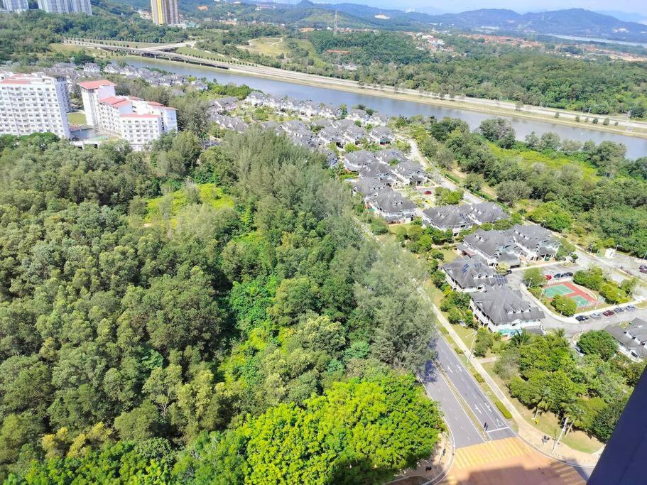 an aerial view of a parking lot next to a river at Lakeview 3 Bedroom Apartment in Presint 18 Putrajaya in Putrajaya