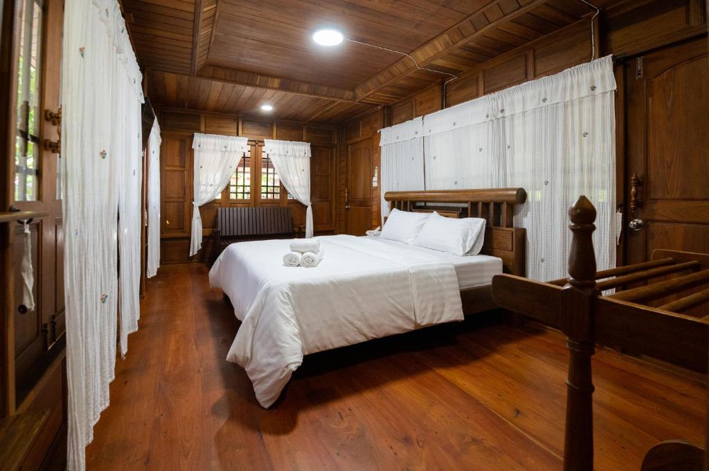 Postel nebo postele na pokoji v ubytování Suk Sabai Homestay