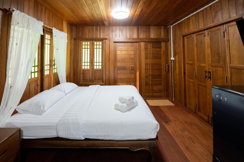 Postel nebo postele na pokoji v ubytování Suk Sabai Homestay
