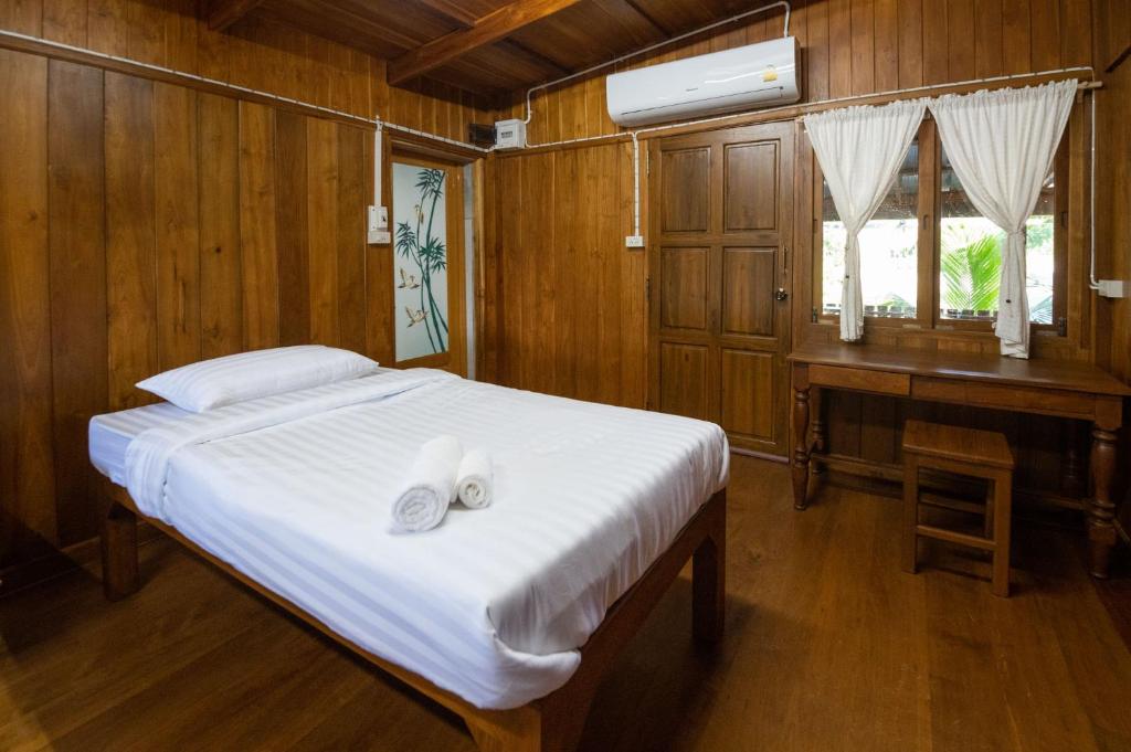 Postel nebo postele na pokoji v ubytování Suk Sabai Homestay