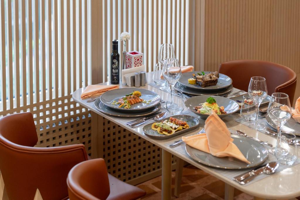a table with plates of food on top of it at Megasaray Club Belek in Belek