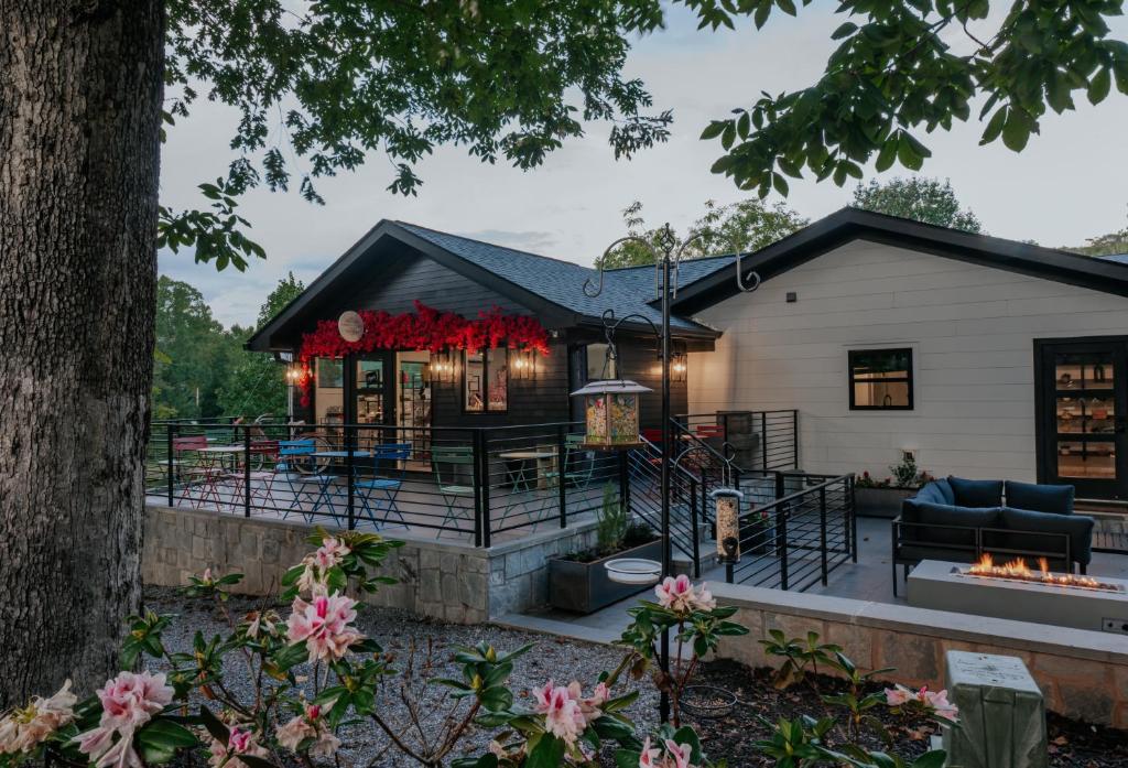 a house with a patio and a fireplace at Tranquille Resort in Hiawassee