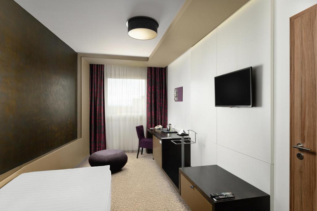 TV a/nebo společenská místnost v ubytování Corso Hotel Pécs