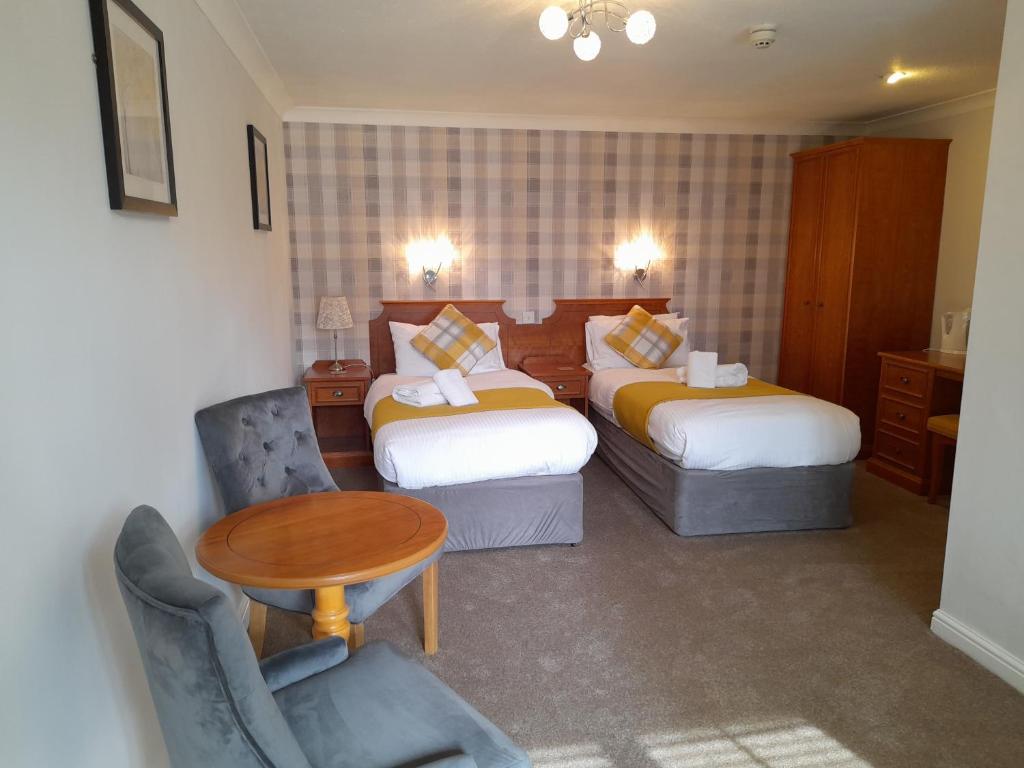 Postel nebo postele na pokoji v ubytování East Ayton Lodge Hotel, Scarborough