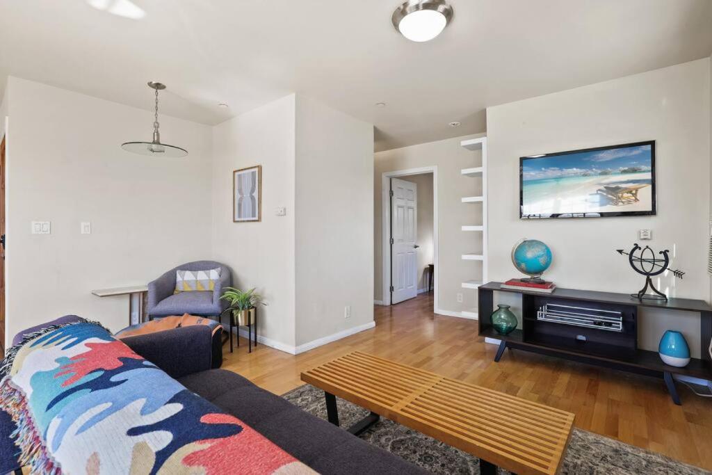 a living room with a couch and a tv at Private, Quiet 2BR in Central Culver City Parking in Los Angeles