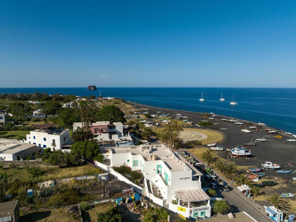 an aerial view of a small town next to the ocean at Hotel Ossidiana Stromboli Center in Stromboli