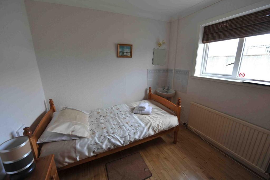 Voodi või voodid majutusasutuse Sandwick Bay Guest House toas