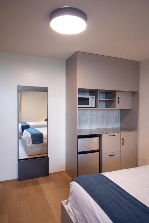 Postel nebo postele na pokoji v ubytování ESHEL SUITES PANAMA