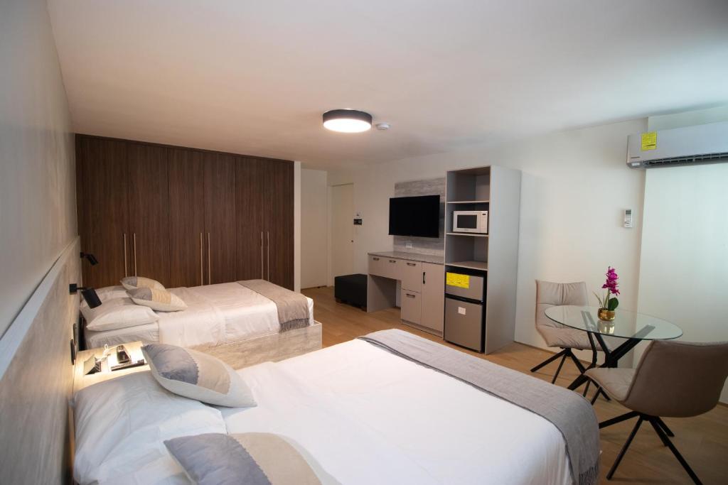 Postel nebo postele na pokoji v ubytování ESHEL SUITES PANAMA
