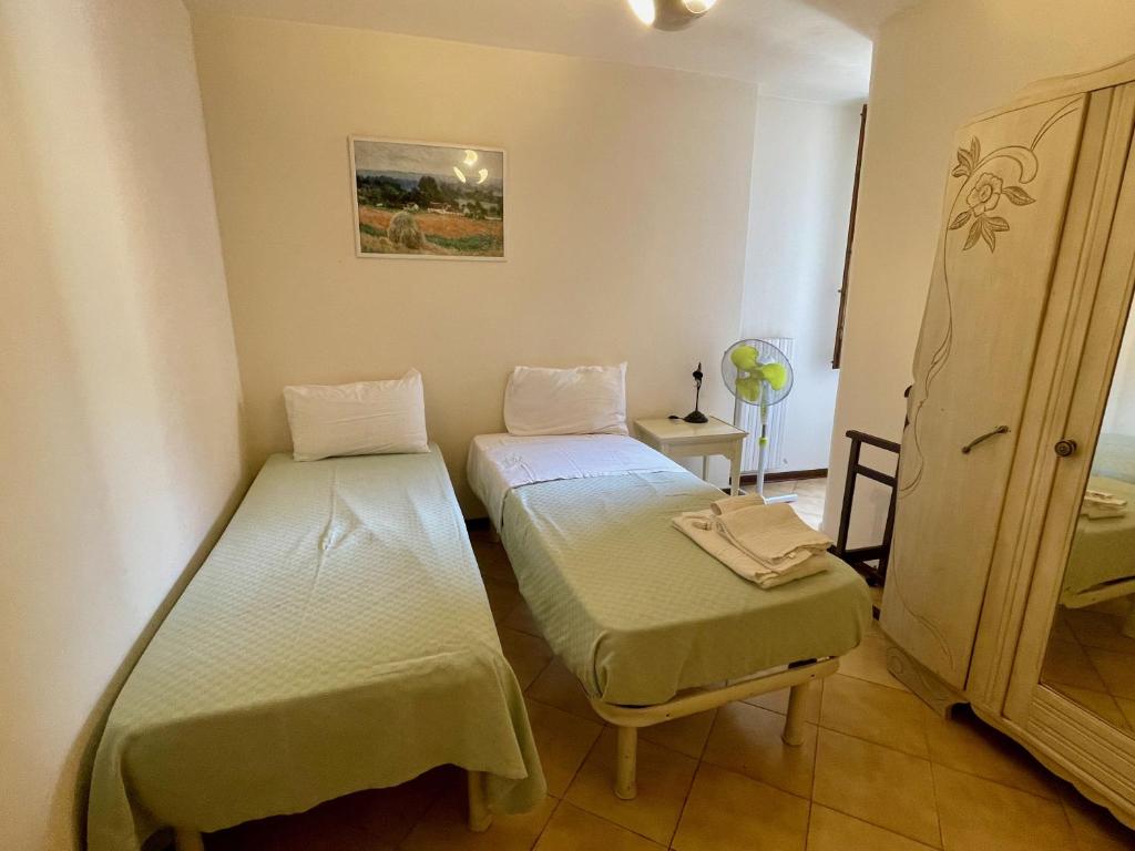 A bed or beds in a room at Palazzo Bianchetti