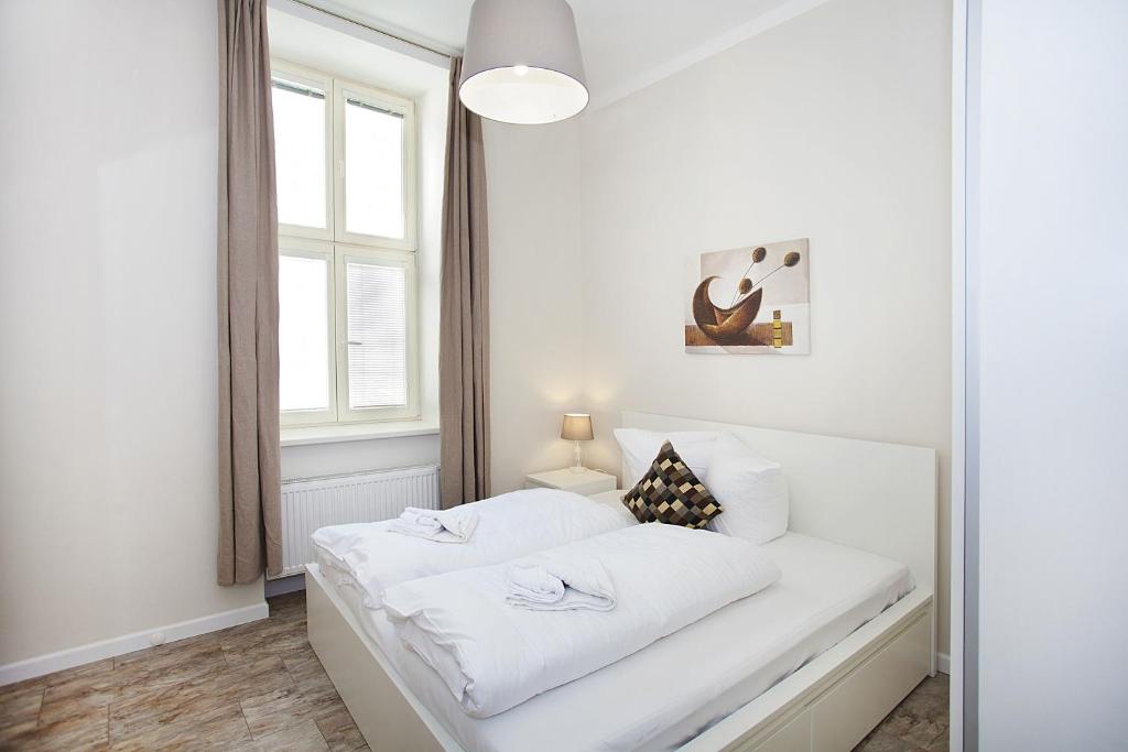 Postel nebo postele na pokoji v ubytování Celebration Flat by Ruterra