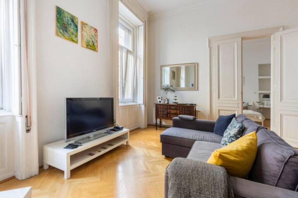 A television and/or entertainment centre at Bourgeois Elegance in the heart of Budapest