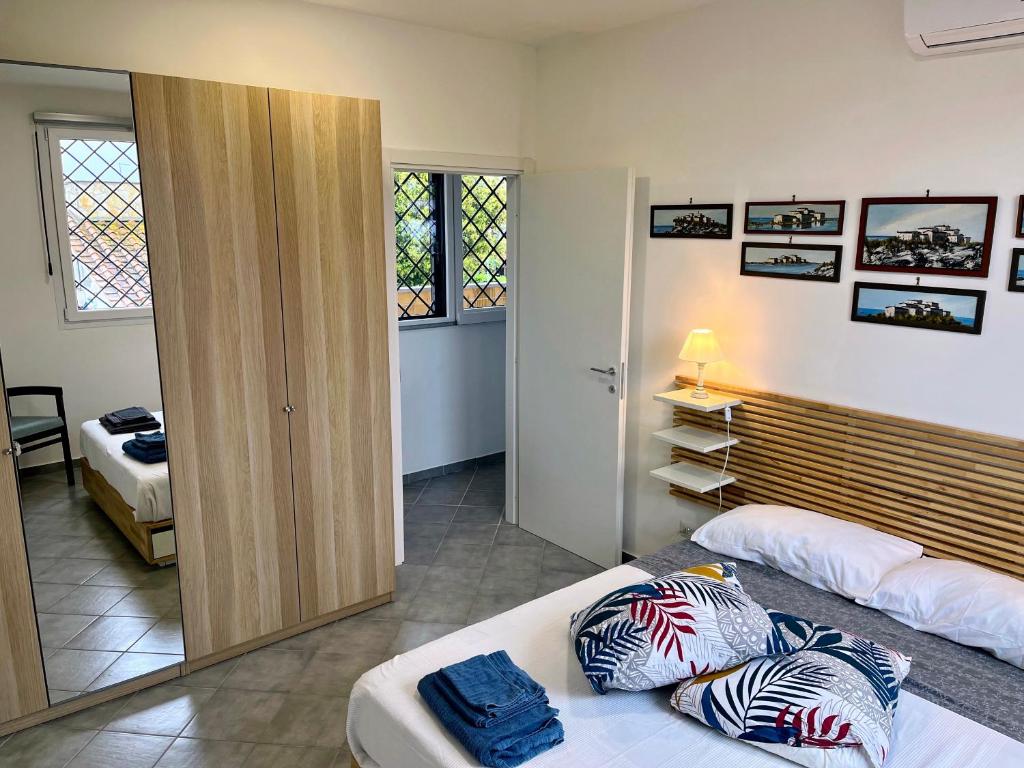 Postel nebo postele na pokoji v ubytování Casa Zefiro, tra pineta e mare!