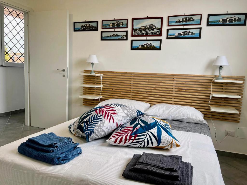 Postel nebo postele na pokoji v ubytování Casa Zefiro, tra pineta e mare!