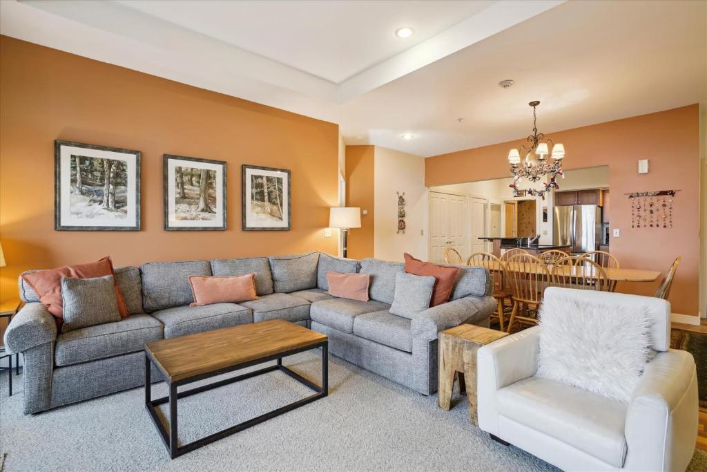 a living room with a couch and a table at Gorgeous views, tastefully decorated Ski on ski off 3 bedroom condo, with sports center access Lodges 303 in Killington