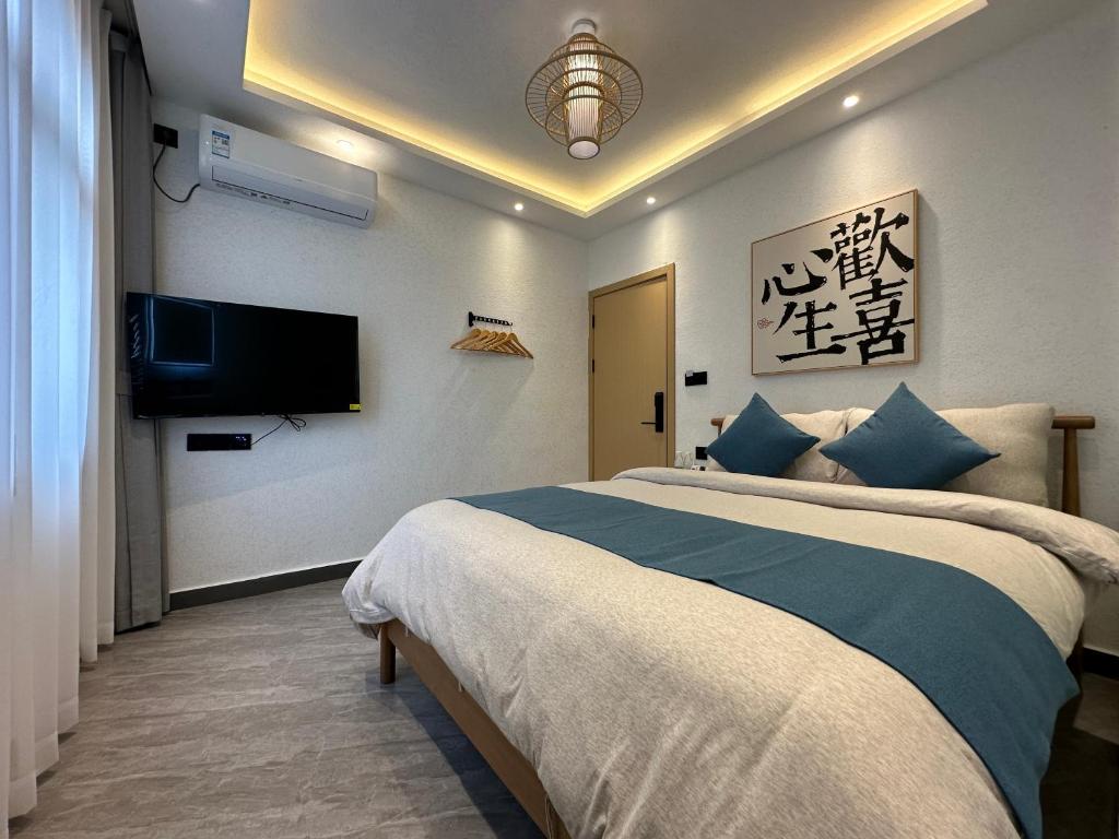 Postel nebo postele na pokoji v ubytování Yifangyan - Tingyuan Qingshe Hostel