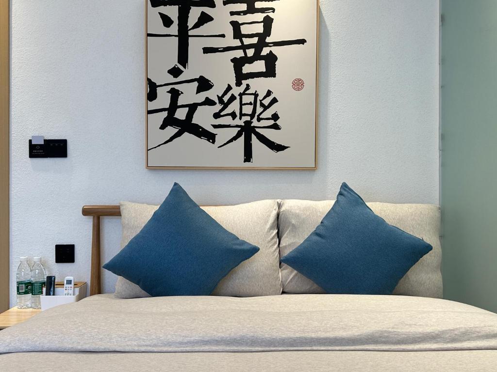 Postel nebo postele na pokoji v ubytování Yifangyan - Tingyuan Qingshe Hostel