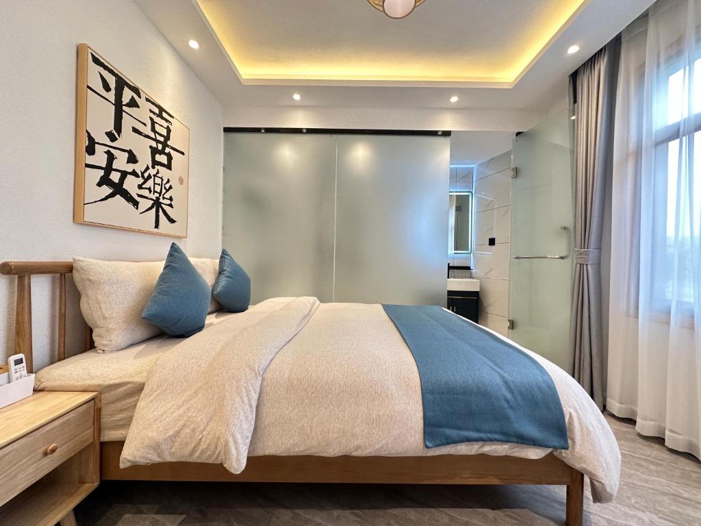 Postel nebo postele na pokoji v ubytování Yifangyan - Tingyuan Qingshe Hostel