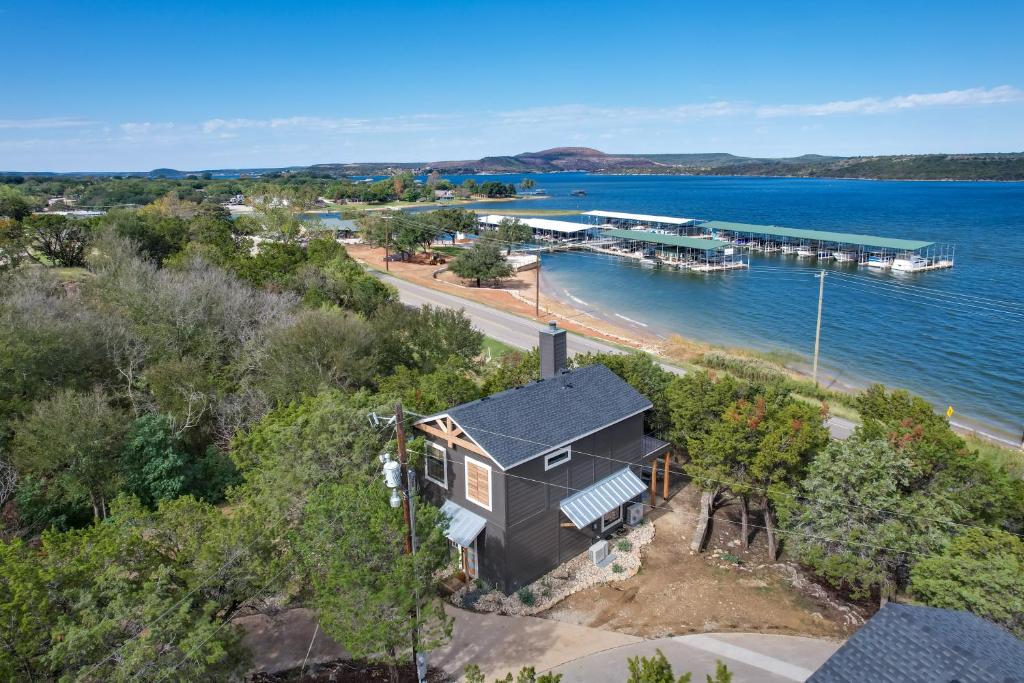 an aerial view of a house next to a marina at Modern Graford Cabin Walk to Possum Kingdom Lake! in Graford