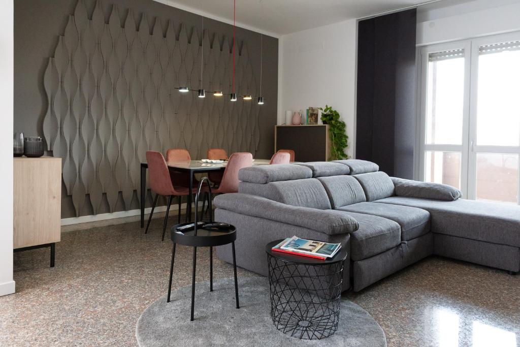 a living room with a couch and a table at Exclusive Guest House - Fiera Milano Rho in Rho