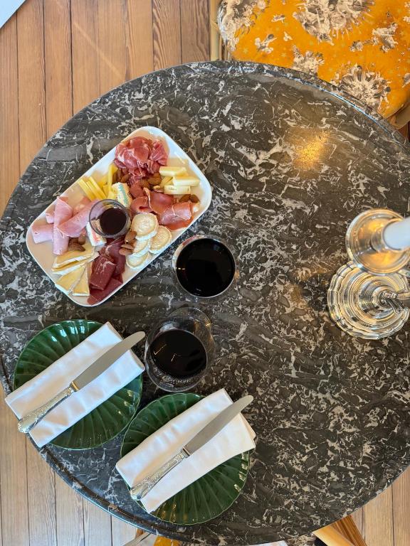 a glass table with a plate of food on it at La Course in Bordeaux
