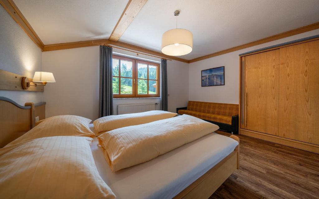 Posteľ alebo postele v izbe v ubytovaní Landhaus Bellevue