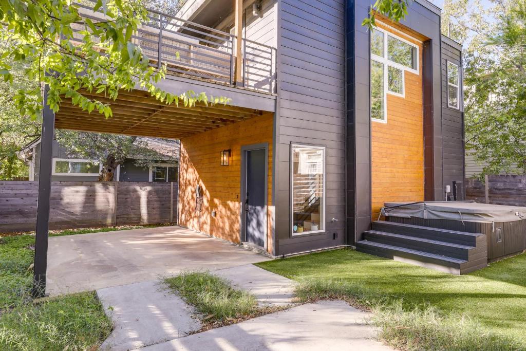a home with a porch and stairs leading to the front door at Stylish Austin Home with Hot Tub 3 Mi to Downtown! in Austin