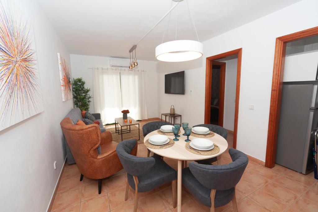 a living room with a table and chairs at Luxury Suite Ocean Views in Tías