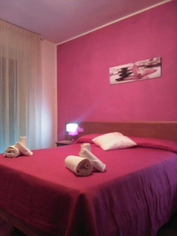 Postel nebo postele na pokoji v ubytování Hotel Tre Monti